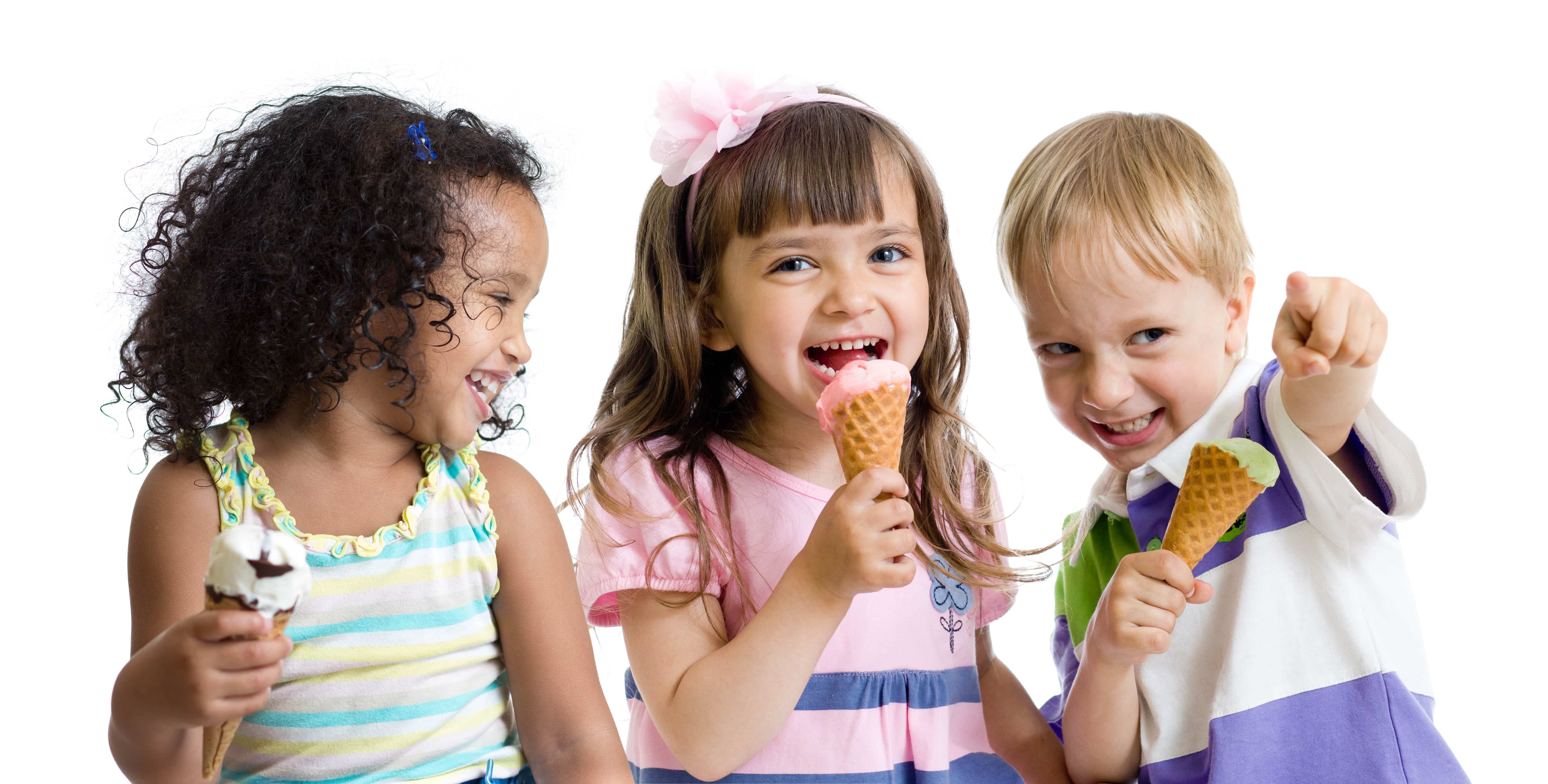 happy kids  eating ice  cream  in studio isolated Parker Chase