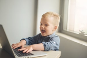 Child playing on laptop