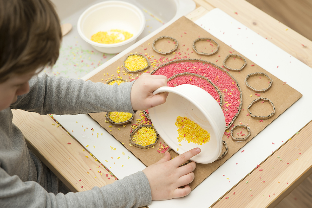 children exploring phonetics using Montessori movable alphabet materials